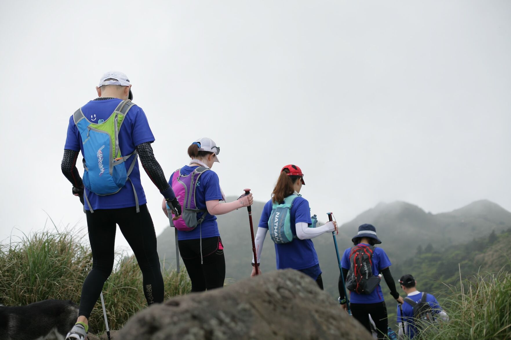 People walk down trail on weekend hike